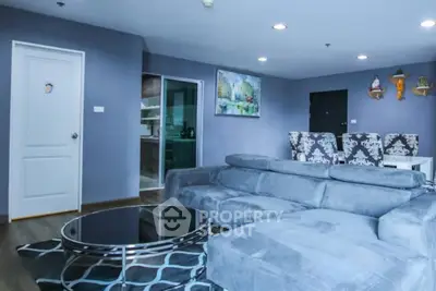 Spacious modern living room with plush gray sofa and stylish decor