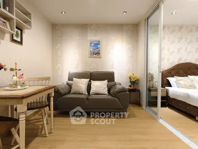 Cozy living room with elegant decor and adjacent bedroom in modern apartment