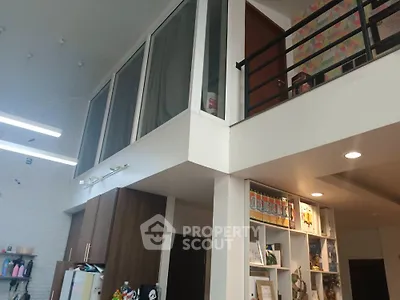 Modern loft interior with high ceilings and stylish decor