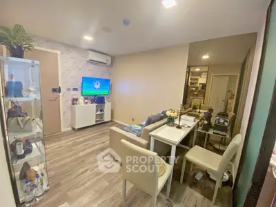 Cozy living room with modern decor and dining area, perfect for relaxation and entertainment.