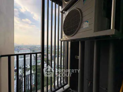 Stunning city view from a high-rise balcony with modern air conditioning units.