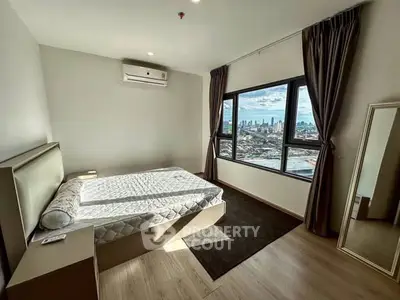 Modern bedroom with city view and natural light