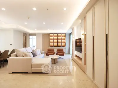 Luxurious modern living room with elegant furniture and ambient lighting, perfect for relaxation and entertainment.