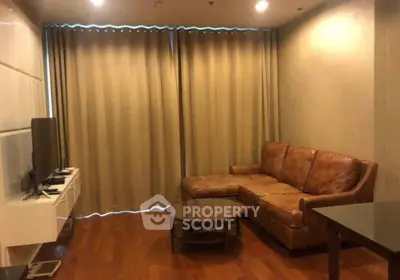 Cozy living room with leather sofa and modern entertainment setup