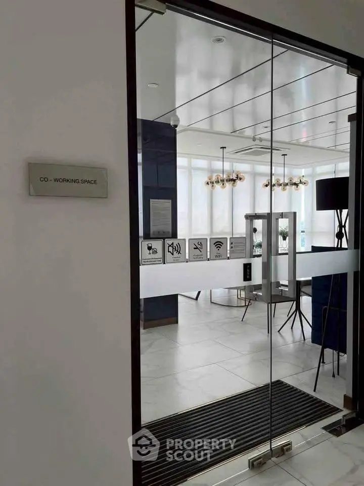 Modern co-working space with glass doors and stylish interior design