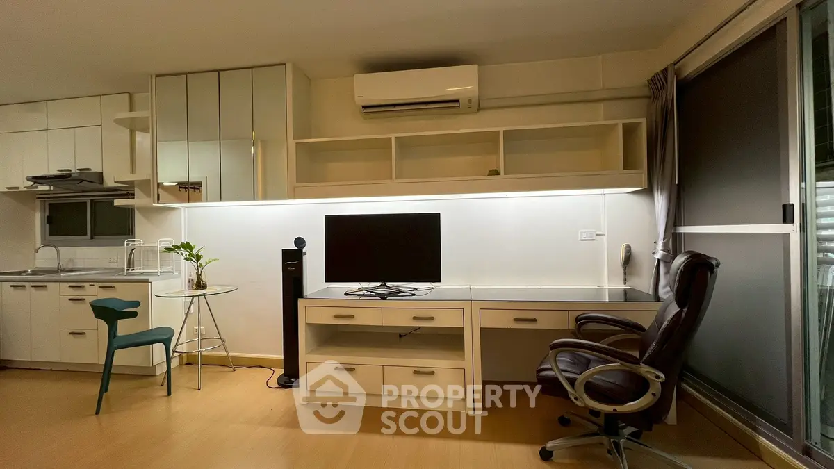 Modern home office with sleek desk, ergonomic chair, and stylish decor in a bright apartment.