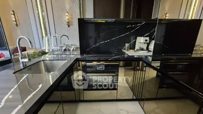 Luxurious modern kitchen with sleek black marble countertops and built-in appliances