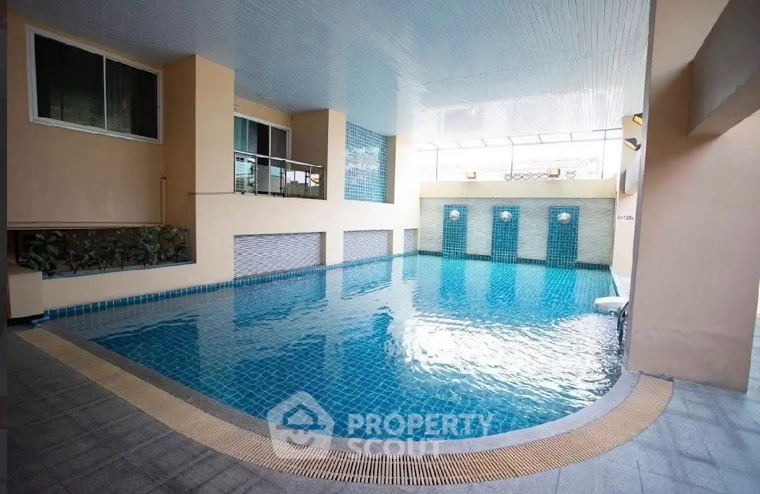 Luxurious indoor swimming pool with modern design and elegant finishes.