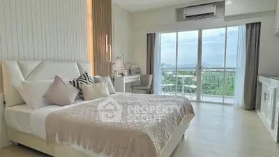 Luxurious bedroom with stunning balcony view and elegant decor