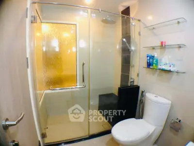 Modern bathroom with glass shower and sleek fixtures