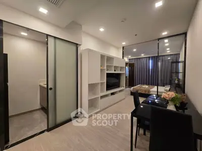 Modern open-plan living room with dining area and sleek furnishings
