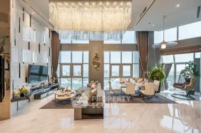 Luxurious high-rise living room with panoramic city views and elegant decor.