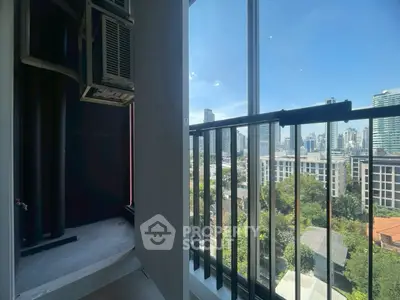 Stunning city view from a modern balcony with sleek railing design.