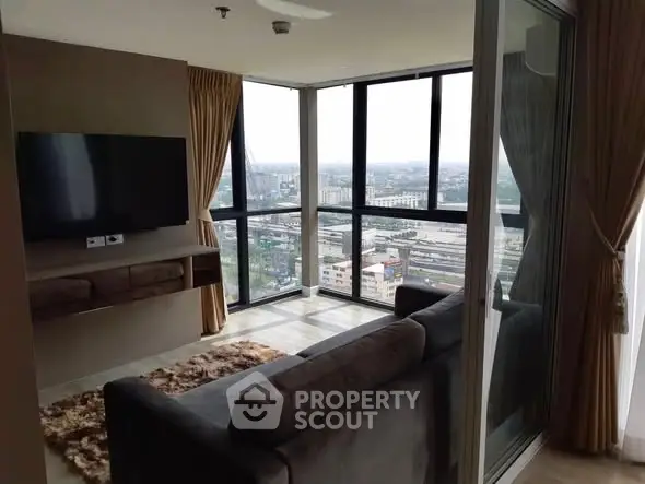 Modern living room with panoramic city view and sleek furnishings