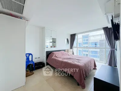 Bright modern bedroom with large windows and stylish decor