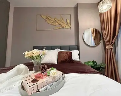 Luxurious bedroom with elegant decor and plush bedding, perfect for relaxation.