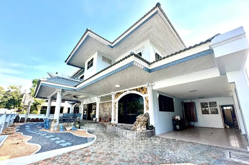 Stunning two-story house with unique architectural design and spacious driveway