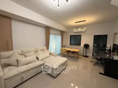 Spacious modern living room with elegant decor and ample natural light