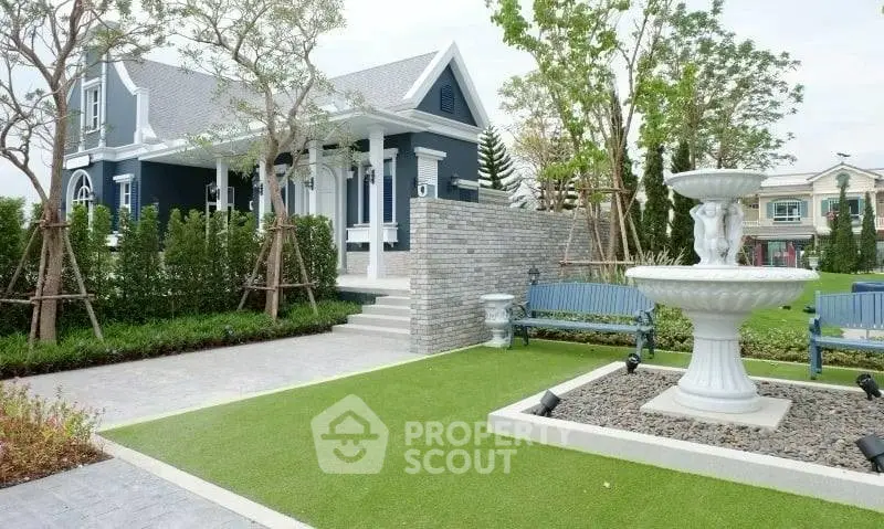 Charming suburban home with manicured garden and elegant fountain