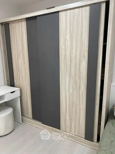 Modern wardrobe with sliding doors in a stylish bedroom setting