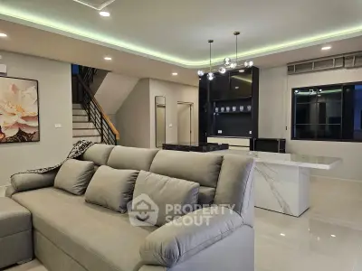 Luxurious modern living room with elegant lighting and spacious seating area