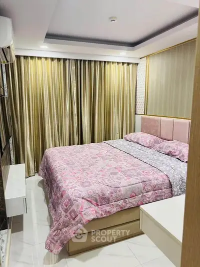 Cozy bedroom with elegant decor and luxurious curtains, perfect for relaxation.