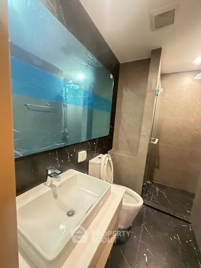 Modern bathroom with sleek design and spacious shower area
