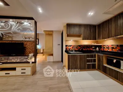 Modern kitchen with stylish cabinetry and open layout in a contemporary apartment.