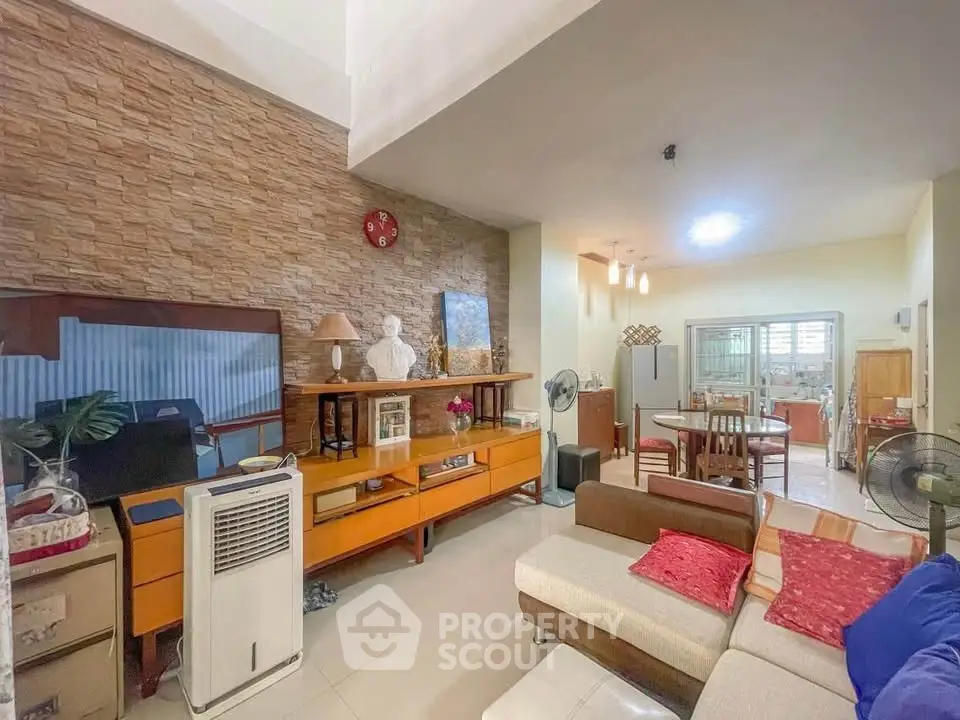 Spacious living room with modern decor and open layout in a stylish home.