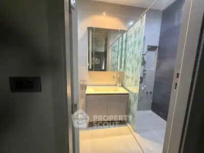 Modern bathroom with sleek design and glass shower enclosure