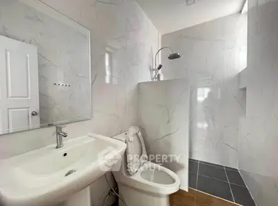Modern bathroom with sleek fixtures and elegant marble tiles