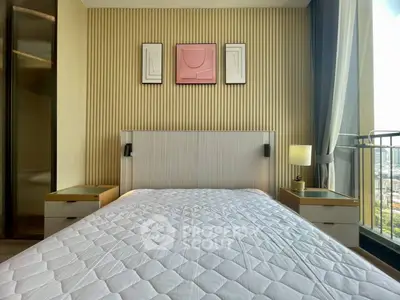 Modern bedroom with stylish decor and large window offering city view