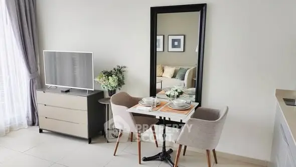 Modern living room with stylish dining area and TV setup