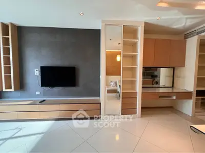Modern living room with sleek built-in storage and wall-mounted TV