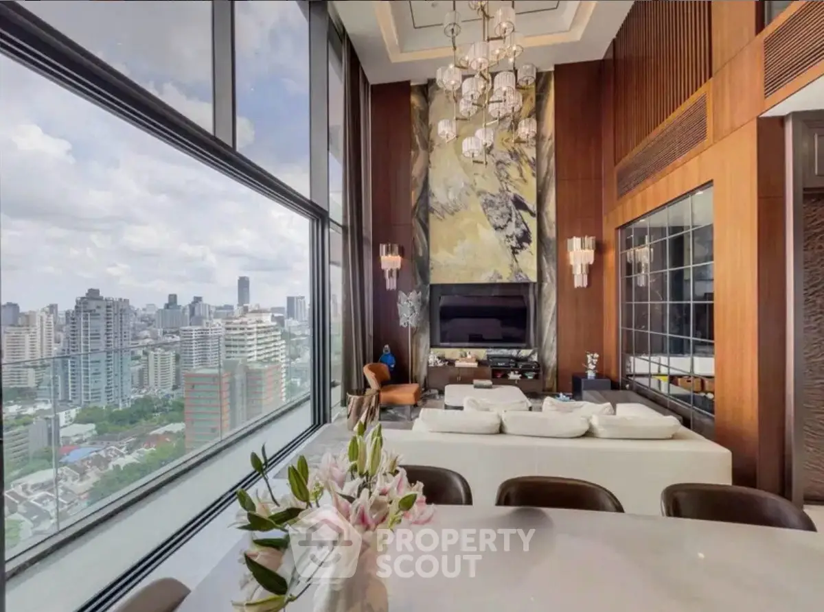 Luxurious high-rise living room with panoramic city views and elegant decor.