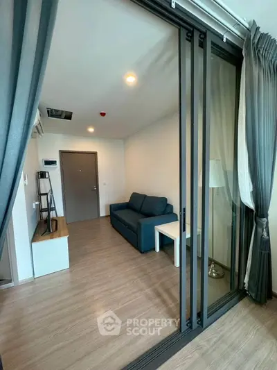 Modern living room with sliding glass doors and stylish decor