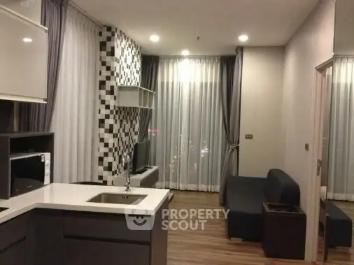 Modern living room with sleek design and stylish decor in a contemporary apartment.