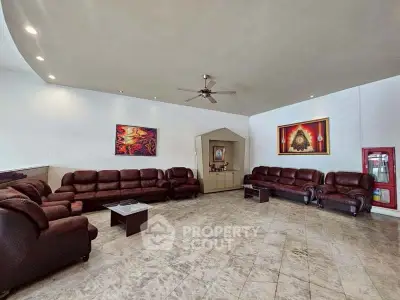 Spacious living room with elegant leather sofas and modern decor