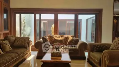 Luxurious living room with elegant sofas and large sliding glass doors