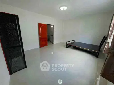 Spacious unfurnished room with glossy tiled floor and natural light, ideal for customization.