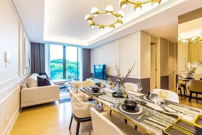 Luxurious modern living room with elegant dining area and scenic view, perfect for sophisticated urban living.
