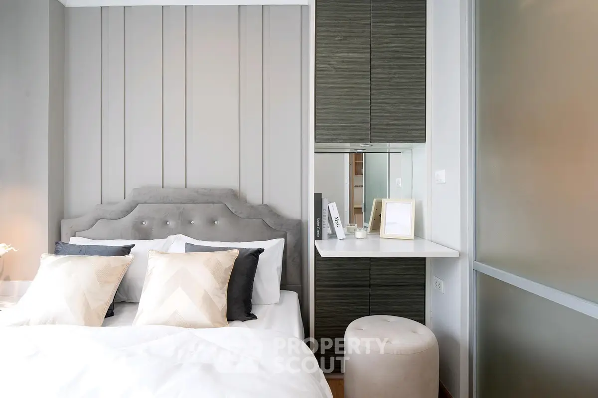 Modern bedroom with stylish decor and plush bedding