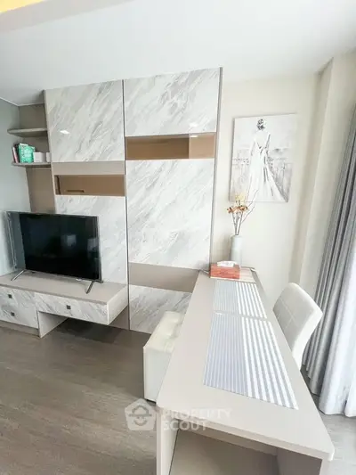 Modern living room with stylish TV unit and elegant decor