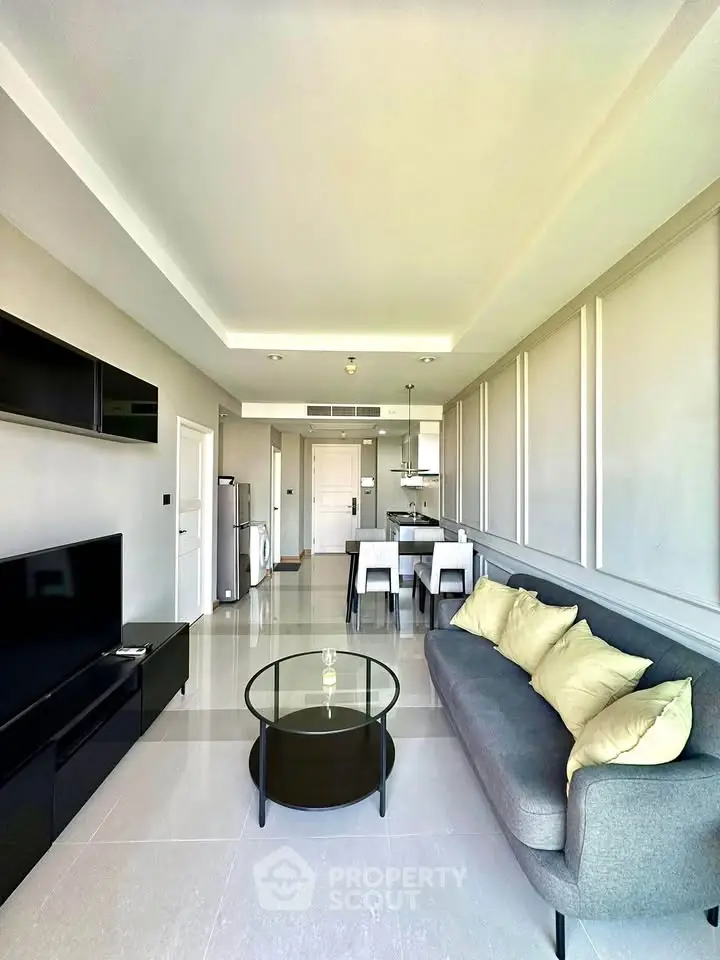 Modern living room with sleek furniture and open layout, perfect for urban living.