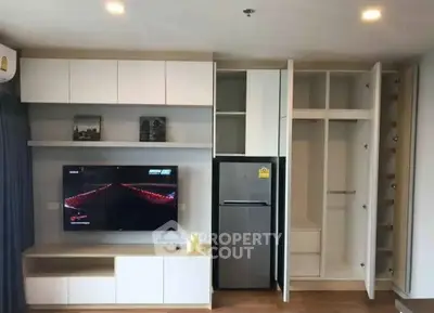 Modern living room with built-in storage and sleek appliances