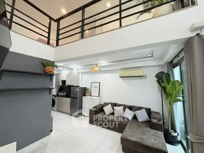 Modern loft-style living room with sleek design and cozy seating area