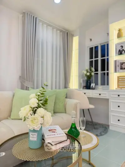 Chic living room with elegant decor, plush sofa, and stylish coffee table in modern home.