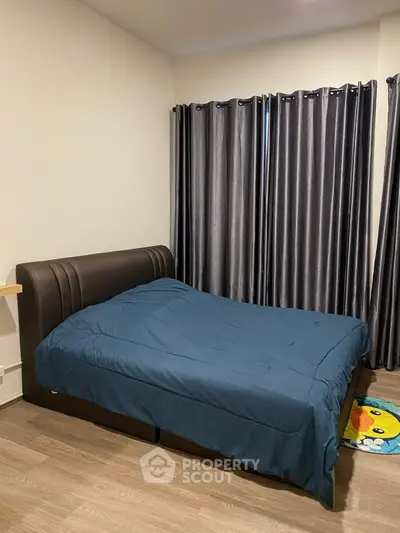 Cozy bedroom with elegant curtains and modern flooring