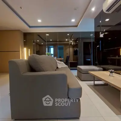 Modern living room with sleek design and comfortable seating in a stylish apartment.