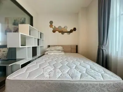 Modern bedroom with stylish decor and ample natural light